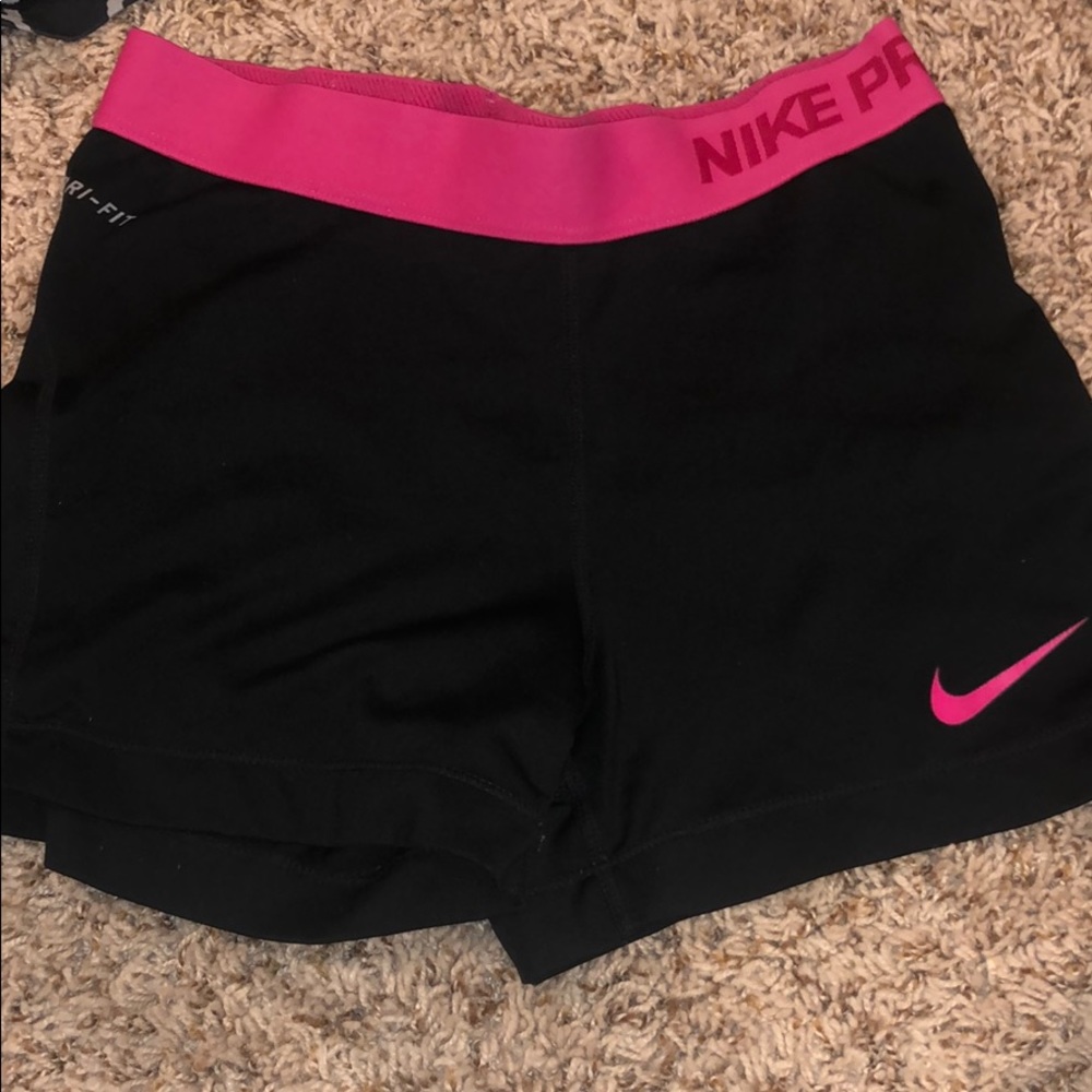 Black nike pros with pink band